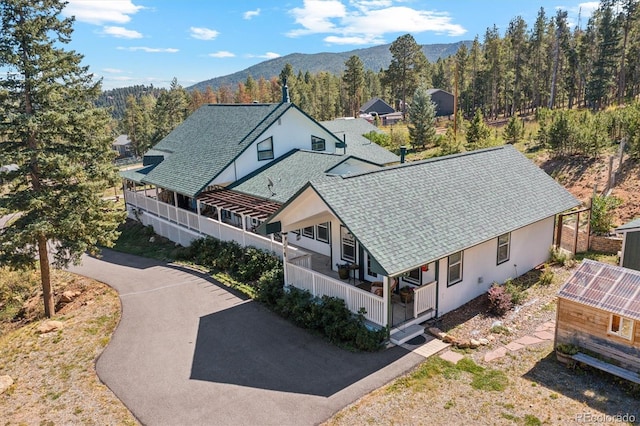 birds eye view of property with a mountain view