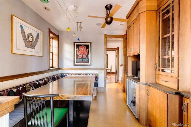 kitchen featuring ceiling fan and decorative light fixtures