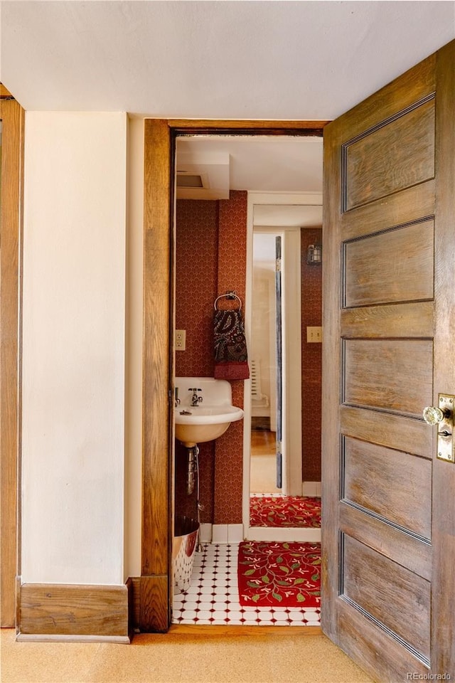 bathroom featuring tile floors and sink