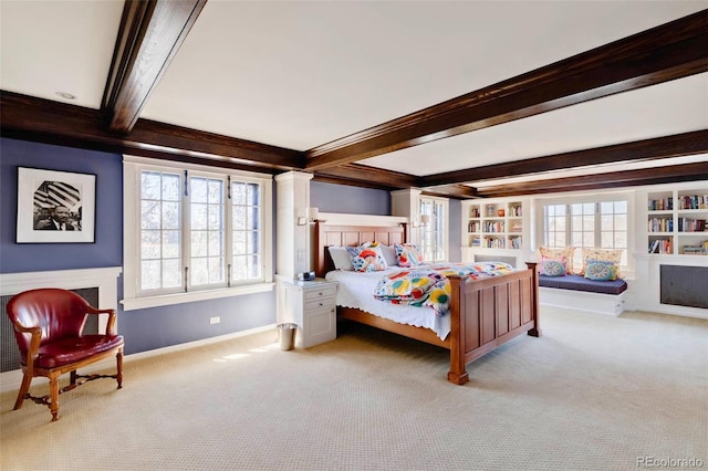 bedroom featuring beamed ceiling and carpet flooring