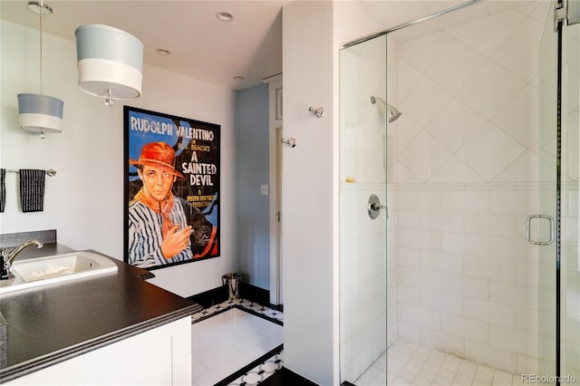 bathroom featuring vanity and a shower with door