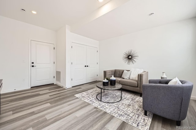 348 N Geneva St, Aurora, CO 80010 - living room with wood finished floors, baseboards, and recessed lighting