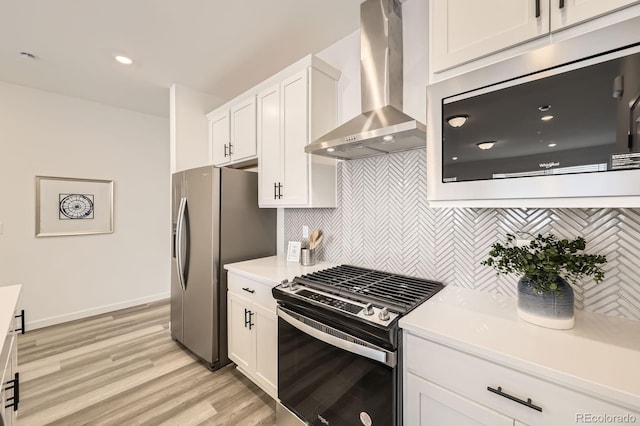 348 N Geneva St, Aurora, CO 80010 - kitchen with stainless steel appliances, wall chimney exhaust hood, white cabinetry, backsplash, and light countertops