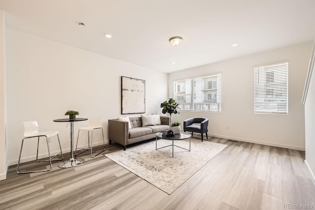 348 N Geneva St, Aurora, CO 80010 - living room with light wood-style flooring, baseboards, and recessed lighting
