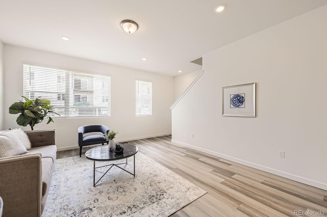 348 N Geneva St, Aurora, CO 80010 - living area featuring light wood-style flooring, baseboards, and recessed lighting
