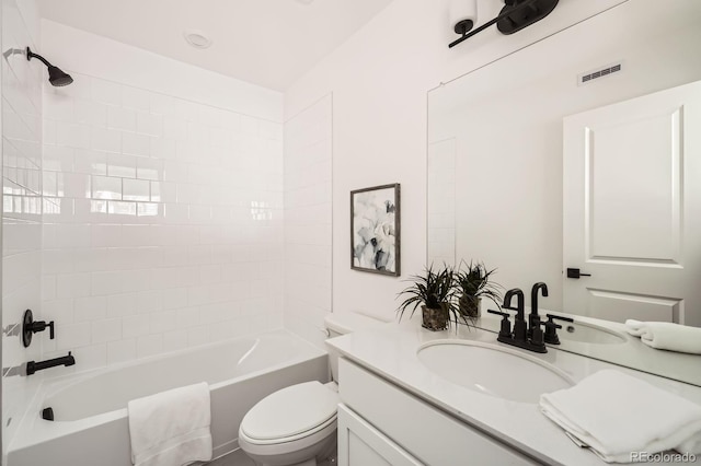 348 N Geneva St, Aurora, CO 80010 - full bath featuring toilet, vanity, and washtub / shower combination