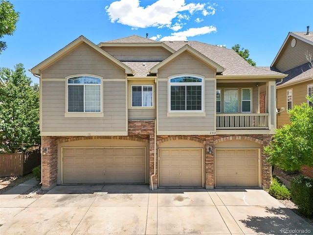 280 Granby Way Unit C, Aurora, CO 80011 - view of front of property with an attached garage, driveway, and roof with shingles