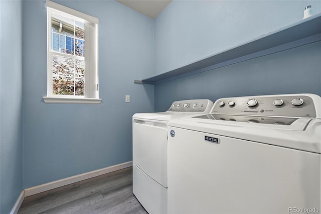 280 Granby Way Unit C, Aurora, CO 80011 - laundry room with washer and dryer and light wood-style flooring