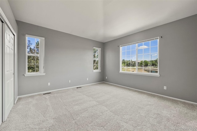 280 Granby Way Unit C, Aurora, CO 80011 - spare room featuring plenty of natural light and carpet flooring