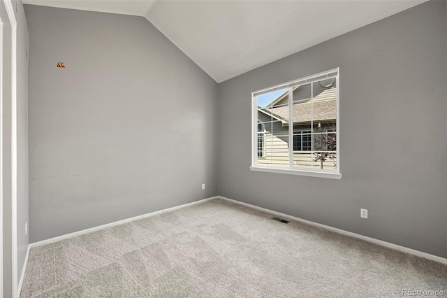 280 Granby Way Unit C, Aurora, CO 80011 - carpeted spare room with vaulted ceiling and baseboards