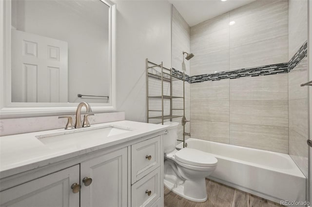 280 Granby Way Unit C, Aurora, CO 80011 - full bathroom featuring wood finished floors, vanity, and washtub / shower combination