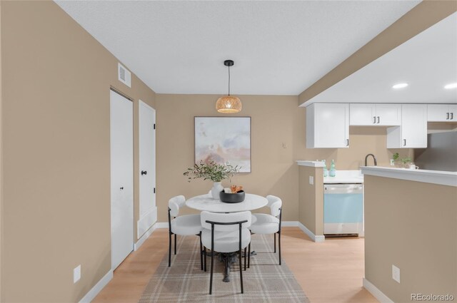 921 S Walden St Unit 205, Aurora, CO 80017 - dining room featuring light wood finished floors, baseboards, and recessed lighting