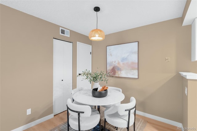 921 S Walden St Unit 205, Aurora, CO 80017 - dining space with light wood-style floors and baseboards