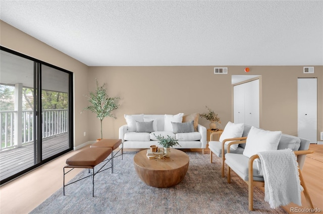 921 S Walden St Unit 205, Aurora, CO 80017 - living room with a textured ceiling