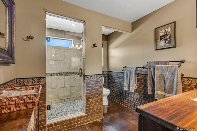 bathroom featuring toilet, concrete flooring, tile walls, and an enclosed shower