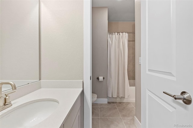 full bathroom with vanity, shower / bathtub combination with curtain, tile patterned floors, and toilet