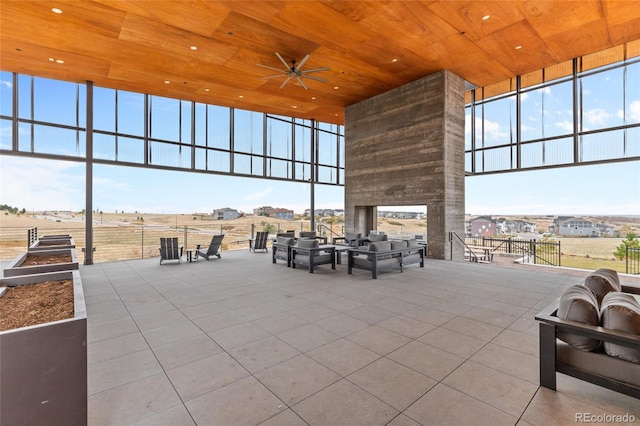 view of patio featuring a ceiling fan and a rural view