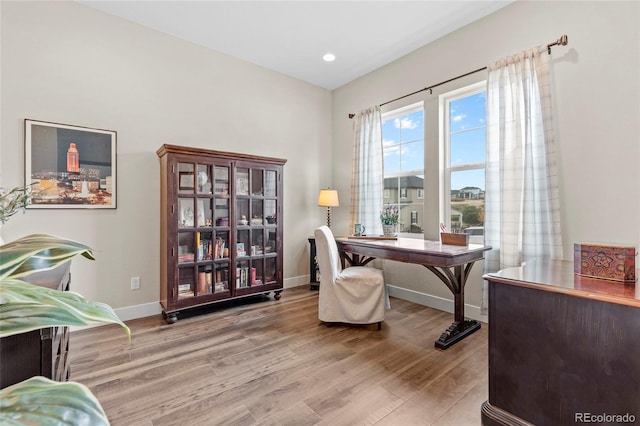 office area with light hardwood / wood-style floors