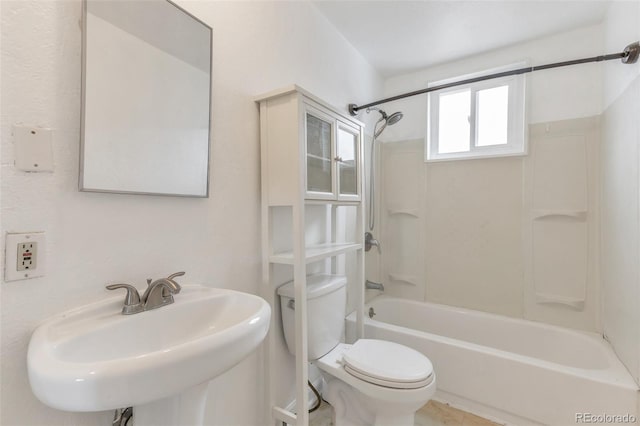 full bathroom featuring bathing tub / shower combination, sink, and toilet