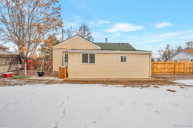 view of snow covered house