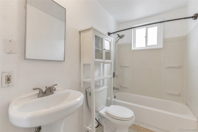 6900 E 66th Ave, Commerce City, CO 80022 - bathroom with a sink, toilet, and washtub / shower combination