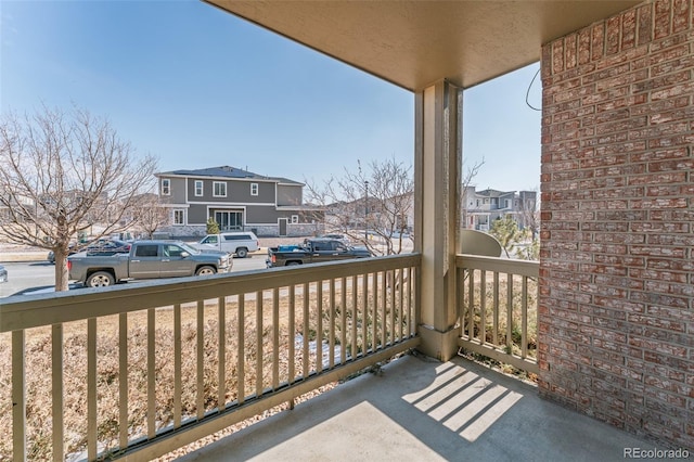 balcony with covered porch and a residential view