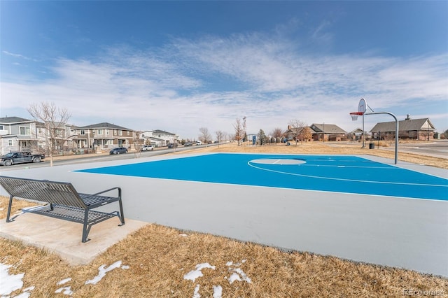 view of sport court featuring community basketball court and a residential view