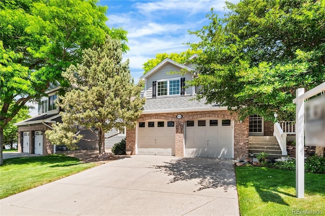 9916 Spring Hill Ln, Highlands Ranch, CO 80129 - view of property hidden behind natural elements featuring brick siding, an attached garage, driveway, and a front lawn