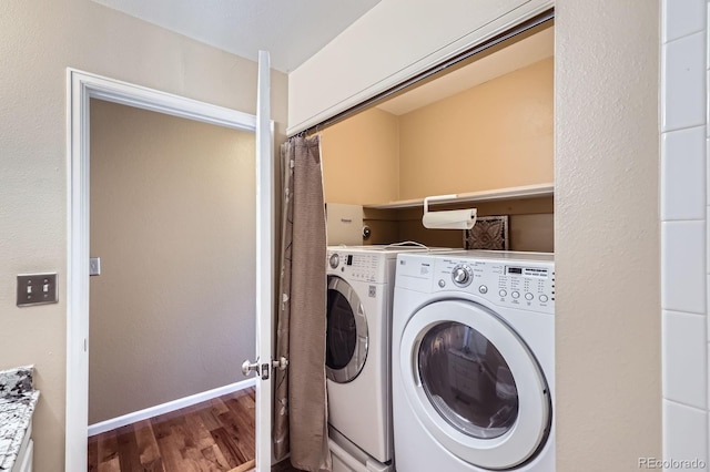 9916 Spring Hill Ln, Highlands Ranch, CO 80129 - laundry area featuring wood finished floors and separate washer and dryer