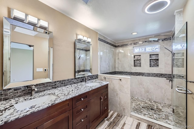 9916 Spring Hill Ln, Highlands Ranch, CO 80129 - bathroom with walk in shower, double vanity, and decorative backsplash