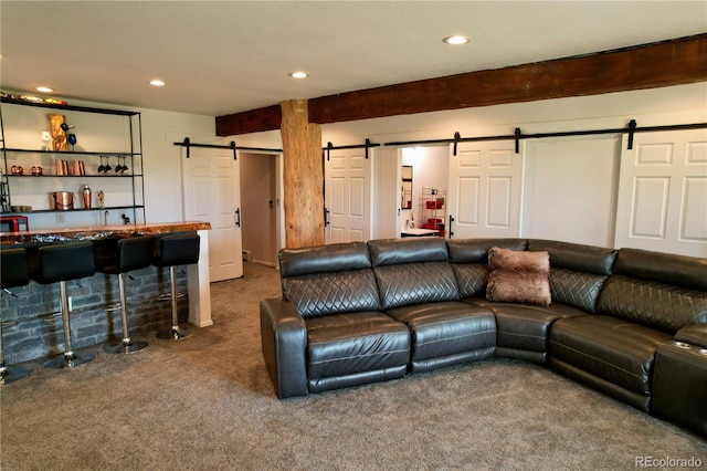 carpeted living room with beam ceiling and a barn door