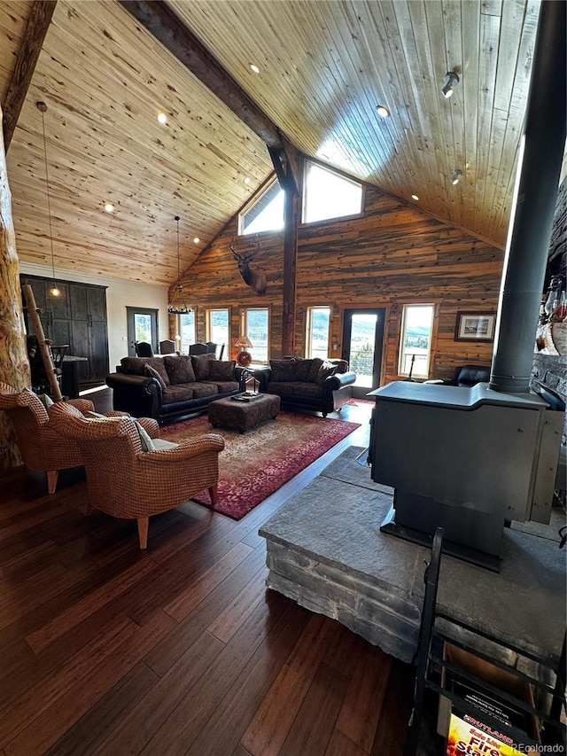 living room with dark hardwood / wood-style flooring, high vaulted ceiling, and wooden ceiling