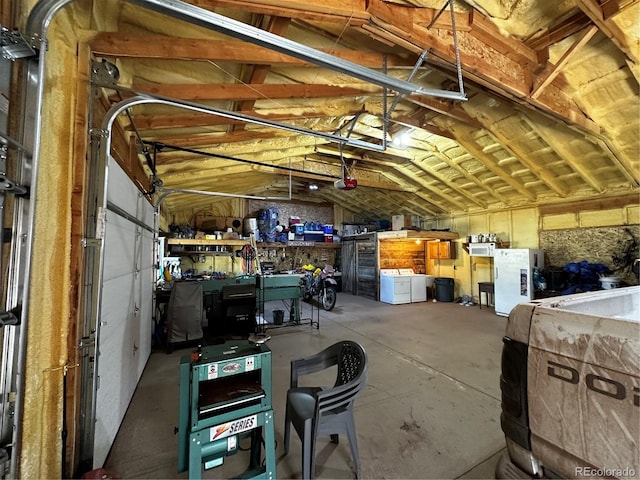 interior space featuring a workshop area and washing machine and clothes dryer