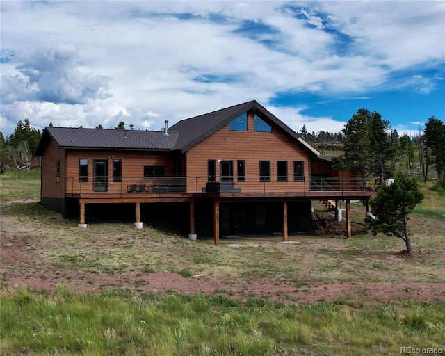 back of house featuring a deck