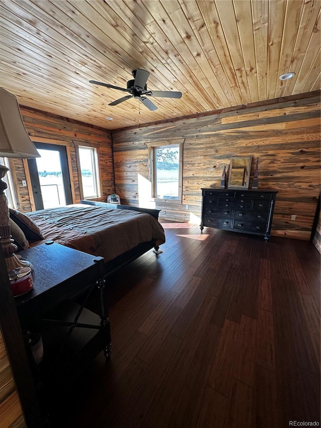 bedroom featuring wood-type flooring, wooden ceiling, and multiple windows