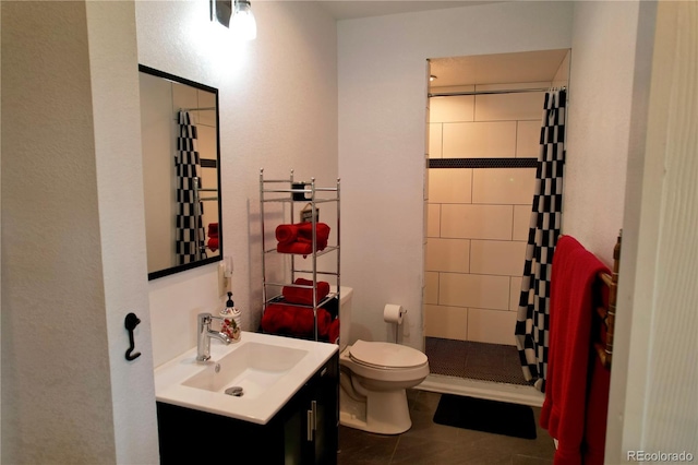 bathroom featuring tile flooring, walk in shower, vanity, and toilet