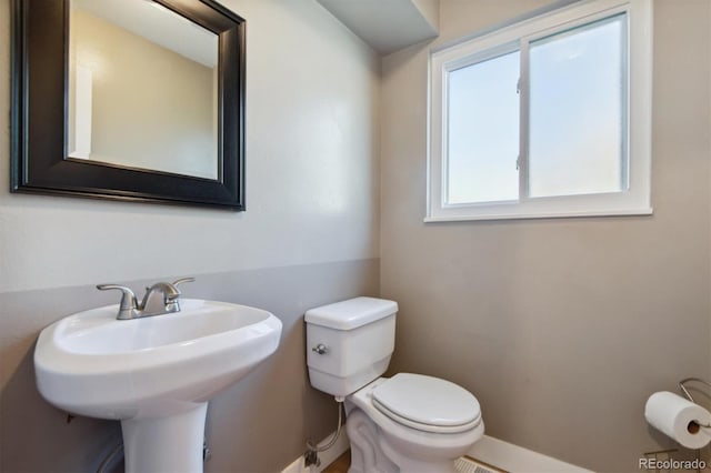 bathroom with sink and toilet