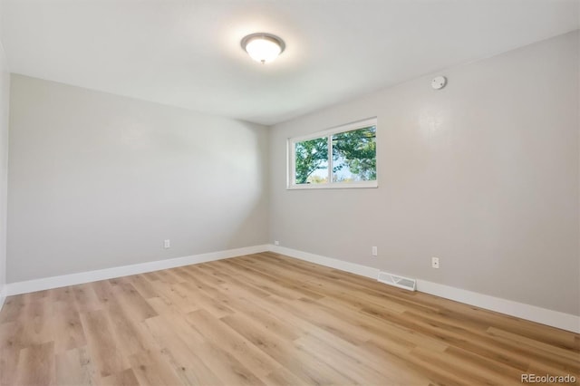 empty room with light wood-type flooring