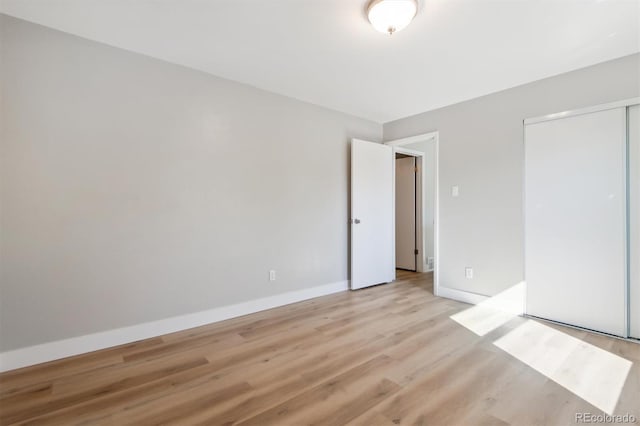 spare room featuring light hardwood / wood-style flooring