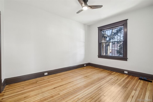 unfurnished room with ceiling fan and light hardwood / wood-style flooring