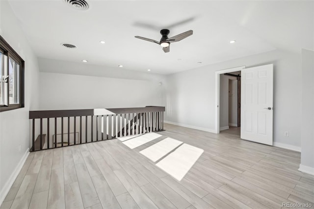 bonus room with light wood-type flooring