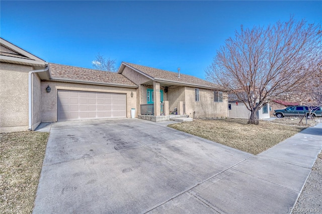 ranch-style house with a garage, concrete driveway, roof with shingles, and stucco siding