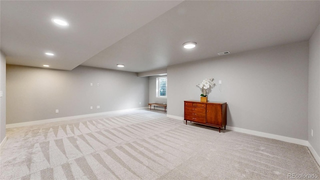 below grade area with carpet floors, baseboards, visible vents, and recessed lighting