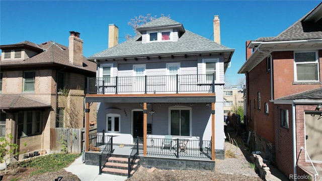 view of front facade with a balcony and a porch