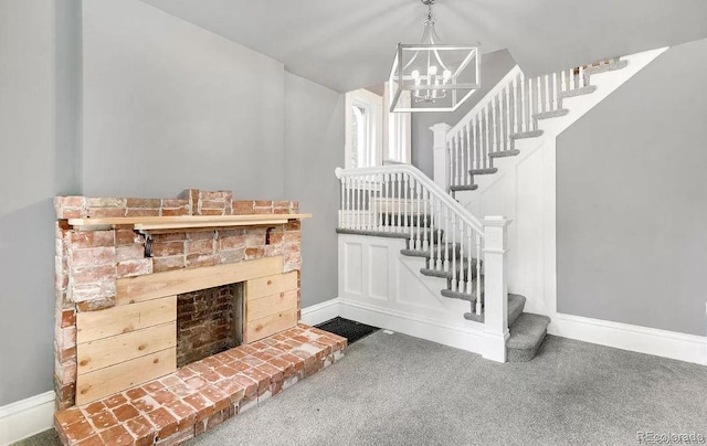 staircase featuring an inviting chandelier and carpet