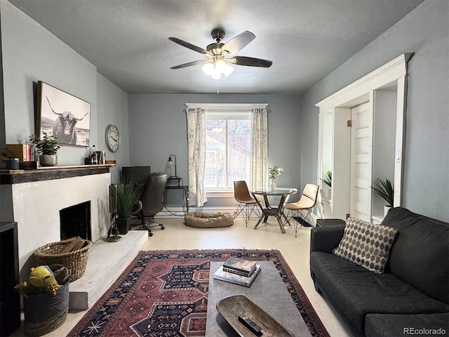 living room with ceiling fan, a premium fireplace, and carpet floors