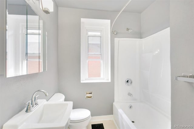 full bathroom featuring toilet, sink, and shower / bathing tub combination