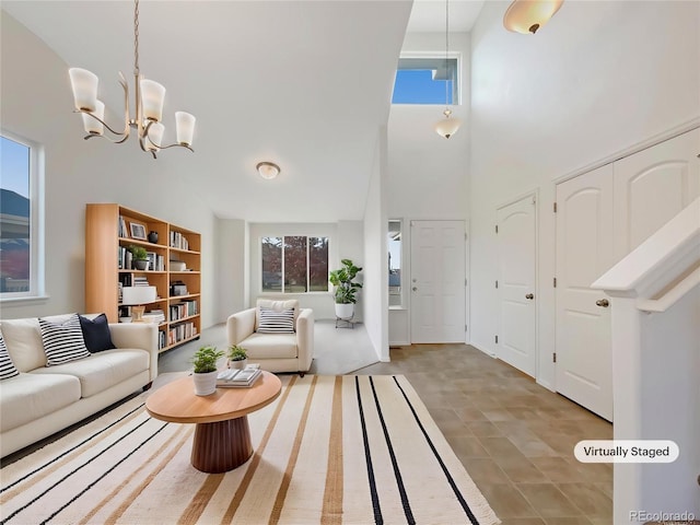 8612 13th St, Greeley, CO 80634 - living area with a towering ceiling, a wealth of natural light, and a chandelier