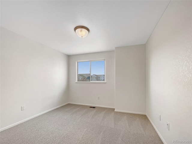 8612 13th St, Greeley, CO 80634 - unfurnished room with baseboards and light colored carpet
