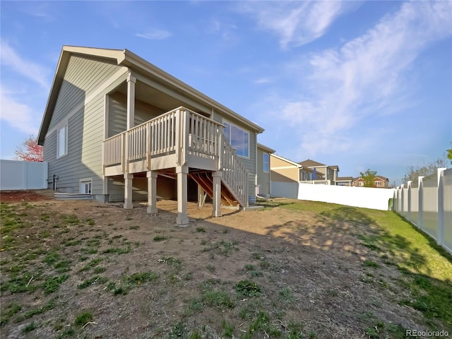 8612 13th St, Greeley, CO 80634 - rear view of property with stairs, a fenced backyard, and a deck